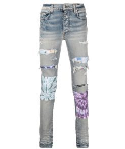 AMIRI PATCH-DETAIL DISTRESSED JEANS